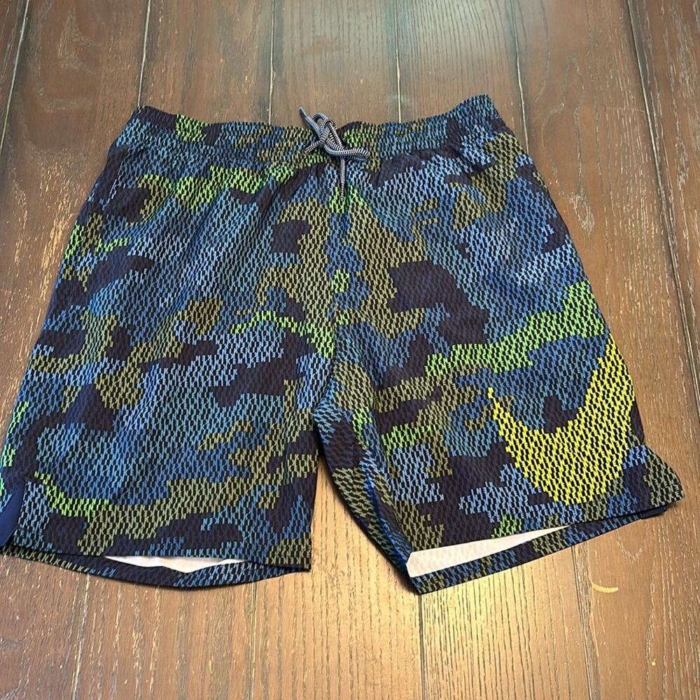 Nike Swim Trunks.  Size M.  Blue background with Nike lettering all over.